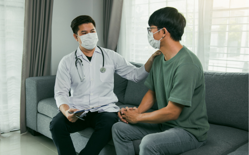Doctor visiting patient at home